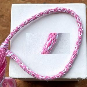 Handmade pink/white floss friendship bracelet